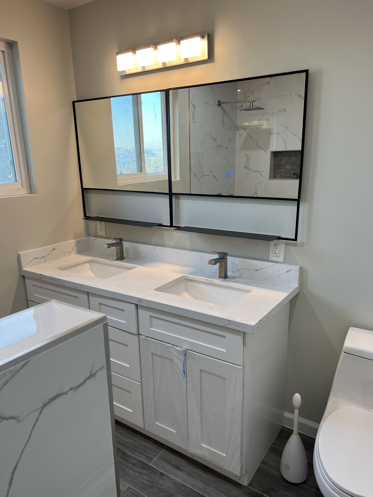 Remodeled bathroom with marble double vanity